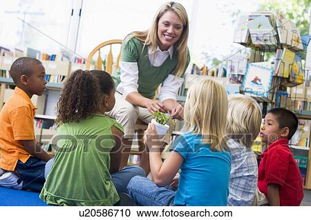 Teacher in class showing students bamboo plant View Large Photo Image Stock Image - Teacher in class showing students bamboo plant. Fotosearch