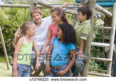Five young friends at a playground smiling View Large Photo Image Stock Photography - Five young friends at a playground smiling. Fotosearch