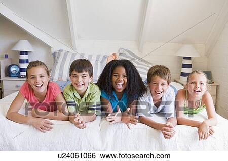 Five Young Friends Lying Down Next To Each Other View Large Photo Image Stock Photograph - Five Young Friends Lying Down Next To Each Other. Fotosearch