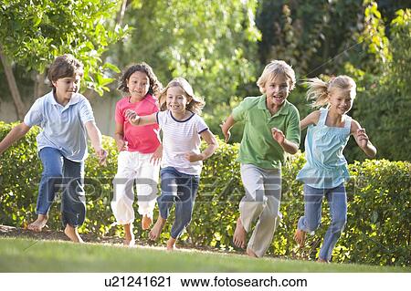 Five young friends running outdoors smiling View Large Photo Image Stock Image - Five young friends running outdoors smiling. Fotosearch