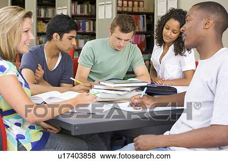 Stock Photo - Five people in library studying (selective focus). Fotosearch