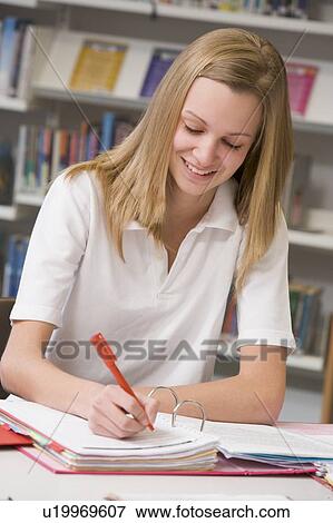 Student writing and studying View Large Photo Image Stock Photo - Student writing and studying. Fotosearch
