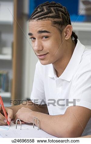 Stock Photo - Student writing and studying. Fotosearch