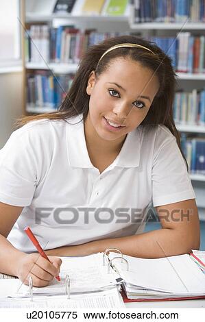 Student writing and studying View Large Photo Image Stock Photography - Student writing and studying. Fotosearch
