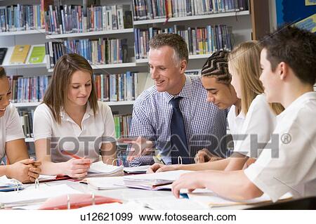 Stock Photo - Students and teacher in a study group collaborating. Fotosearch