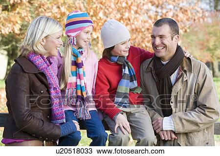 Family outdoors in park smiling (selective focus) View Large Photo Image Stock Image - Family outdoors in park smiling (selective focus). Fotosearch