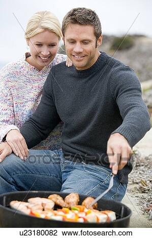 Couple Cooking On A Barbeque View Large Photo Image Stock Image - Couple Cooking On A Barbeque. Fotosearch