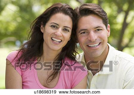 Couple outdoors smiling View Large Photo Image Stock Photo - Couple outdoors smiling. Fotosearch