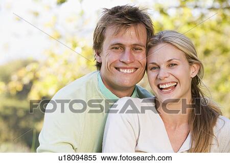Couple outdoors smiling View Large Photo Image Stock Photography - Couple outdoors smiling. Fotosearch