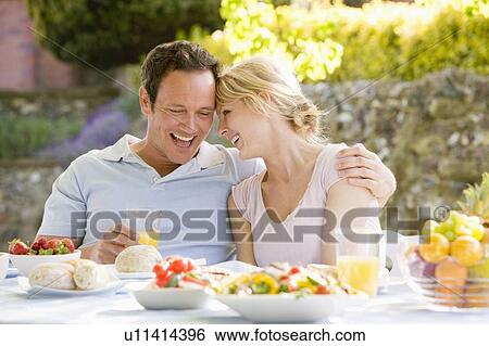 Stock Photograph - Family Enjoying A Barbeque. Fotosearch