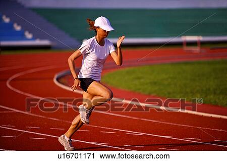 Female athlete running on race track View Large Photo Image Stock Image - Female athlete running on race track. Fotosearch