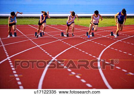 Five female athletes running from track starting blocks View Large Photo Image Stock Photography - Five female athletes running from track starting blocks. Fotosearch