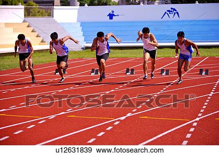 Five male athletes running from track starting blocks View Large Photo Image Stock Photo - Five male athletes running from track starting blocks. Fotosearch