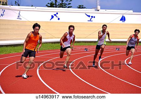 Stock Photo - Four male athletes running on race track. Fotosearch