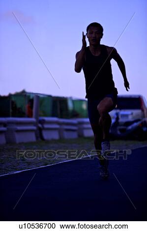 Male athlete running on race track View Large Photo Image Stock Image - Male athlete running on race track. Fotosearch