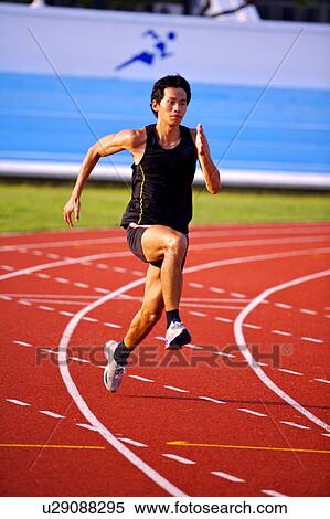 Male athlete running on race track View Large Photo Image Stock Photography - Male athlete running on race track. Fotosearch