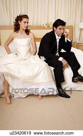 Bride waiting for groom to get off the phone View Large Photo Image Stock Photo - Bride waiting for groom to get off the phone. Fotosearch