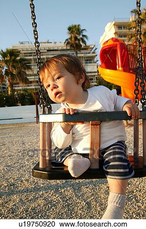 Child on swing View Large Photo Image Stock Image - Child on swing. Fotosearch