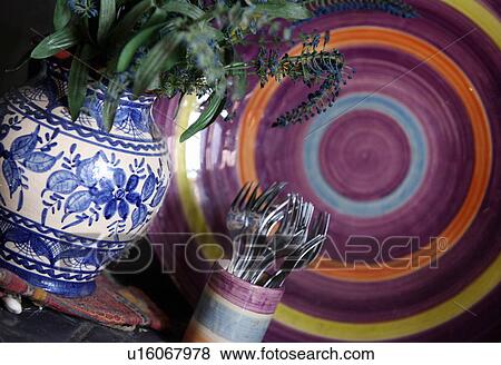 Stock Photo - Closeup of vase, plate, and cup with forks. Fotosearch