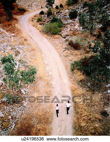 Couple jogging on country road View Large Photo Image Stock Photograph - Couple jogging on country road. Fotosearch