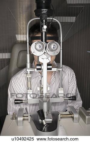 Stock Photography - Patient at optometrist. Fotosearch