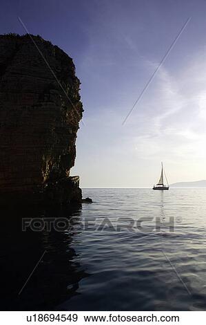 Sailboat in the sea View Large Photo Image Stock Photo - Sailboat in the sea. Fotosearch