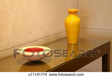 Picture - Sidetable with decorative vase and bowl. Fotosearch