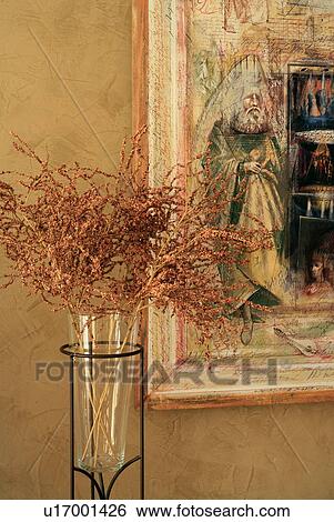 Vase with dried flowers in front of painting View Large Photo Image Stock Photograph - Vase with dried flowers in front of painting. Fotosearch