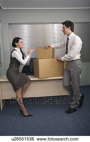Stock Photo - Business people in office with boxes. Fotosearch