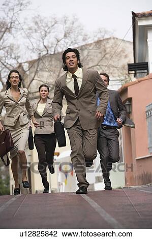 Stock Image - Business people running. Fotosearch