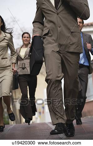 Business people running View Large Photo Image Stock Image - Business people running. Fotosearch