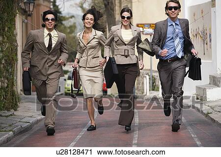 Stock Image - Business people running. Fotosearch