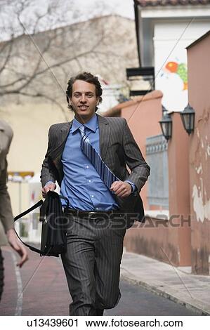 Stock Image - Businessman running. Fotosearch