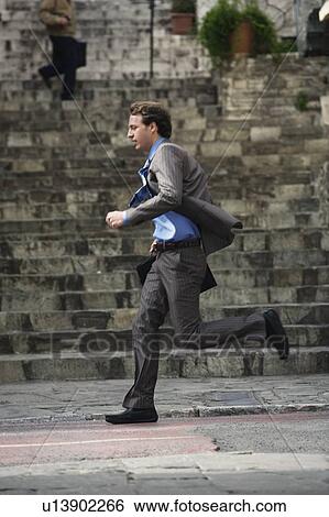 Businessman running View Large Photo Image Stock Photograph - Businessman running. Fotosearch