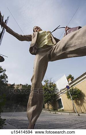 Picture - Businesswoman leaping. Fotosearch