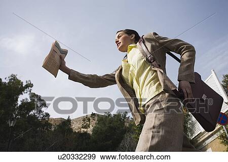 Stock Photo - Businesswoman leaping. Fotosearch