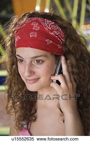 Closeup of female teenager with cell phone View Large Photo Image Stock Photography - Closeup of female teenager with cell phone. Fotosearch