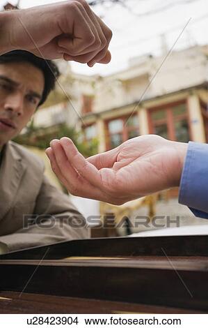 Picture - Closeup of two businessmen playing backgammon. Fotosearch