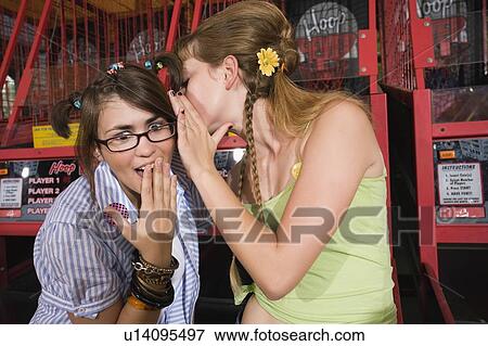 Female teenagers gossiping View Large Photo Image Stock Photo - Female teenagers gossiping. Fotosearch