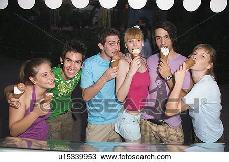 Teenagers eating ice cream View Large Photo Image Stock Image - Teenagers eating ice cream. Fotosearch