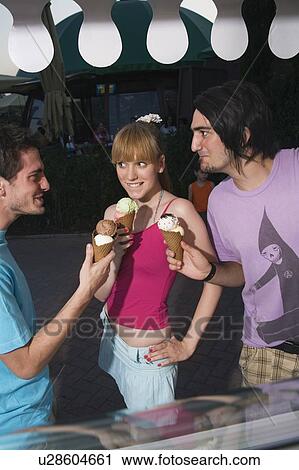 Teenagers eating ice cream View Large Photo Image Stock Image - Teenagers eating ice cream. Fotosearch