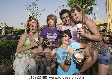 Teenagers hanging out, eating View Large Photo Image Stock Image - Teenagers hanging out, eating. Fotosearch