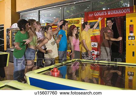 Teenagers in arcade View Large Photo Image Stock Image - Teenagers in arcade. Fotosearch