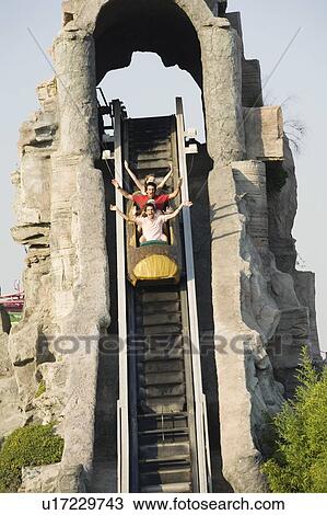 Teenagers on amusement park ride View Large Photo Image Stock Image - Teenagers on amusement park ride. Fotosearch