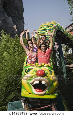 Teenagers on amusement park ride View Large Photo Image Stock Photo - Teenagers on amusement park ride. Fotosearch