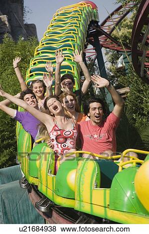 Teenagers on amusement park ride View Large Photo Image Stock Photo - Teenagers on amusement park ride. Fotosearch