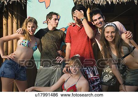 Teenagers posing in amusement park View Large Photo Image Stock Photograph - Teenagers posing in amusement park. Fotosearch