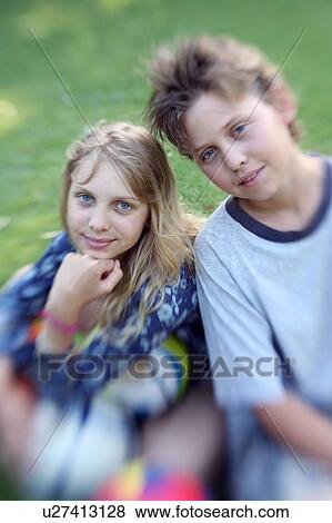 Stock Photo - Boy and girl posing. Fotosearch