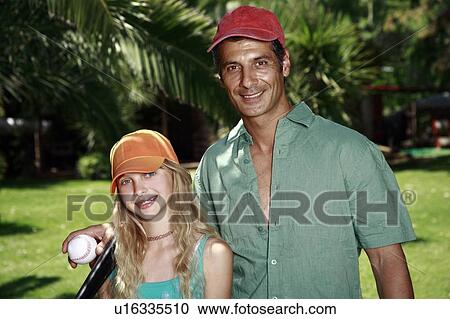 Father and daughter with baseball outfit View Large Photo Image Stock Image - Father and daughter with baseball outfit. Fotosearch