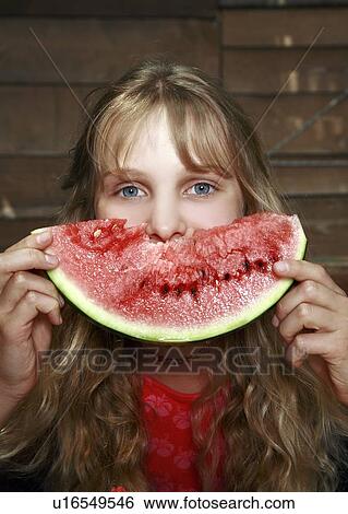 Stock Photograph - Girl posing with watermelon. Fotosearch